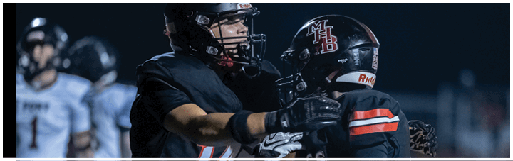 A group of football players in a game. Description generated by AI