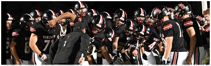 A group of football players in a game. Description generated by AI