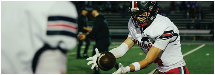 A football game is being played with two teams on the field. Description generated by AI