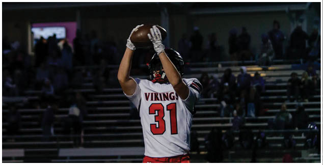 A football player wearing a white jersey with the number 3 on it. Description generated by AI