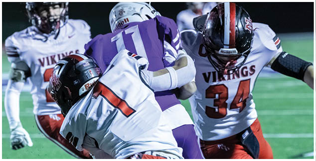 A football player wearing a white jersey with the number 3 on it. Description generated by AI