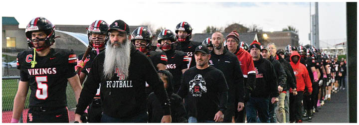 A football game is being played with two teams on the field. Description generated by AI