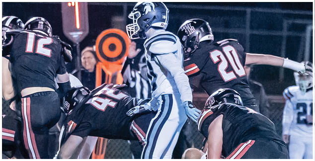 A football player in a white jersey with the number 4 on it. Description generated by AI