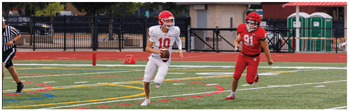 A football player is sliding on the ground. Description generated by AI