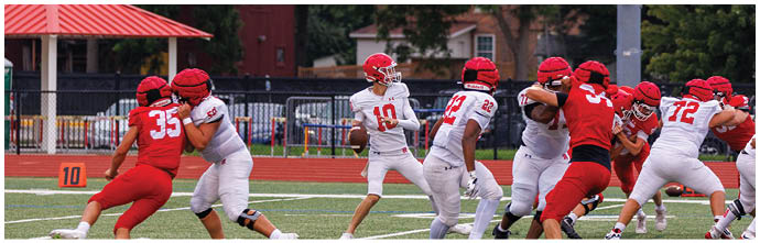 A football player is sliding on the ground. Description generated by AI