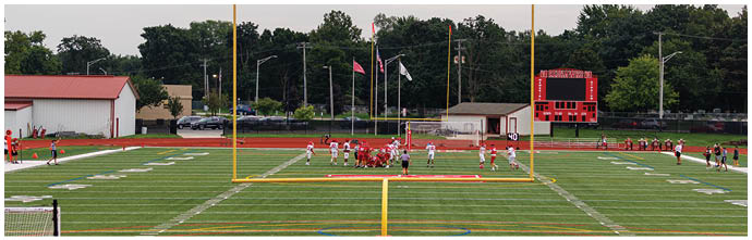 A football player is sliding on the ground. Description generated by AI