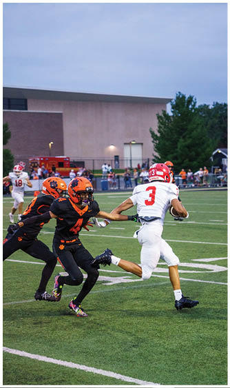 A football player running on the field. Description generated by AI