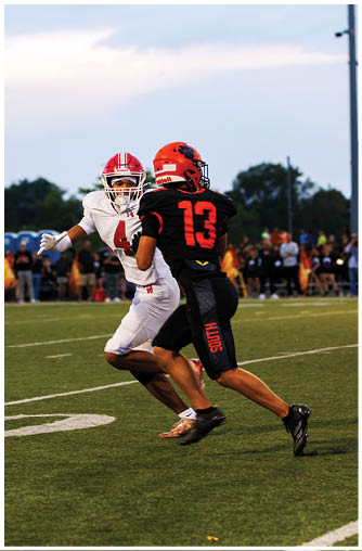 A football player running on the field. Description generated by AI