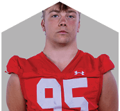 A young man wearing a white jersey with the number 10 on it. Description generated by AI