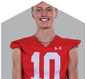 A young man wearing a white jersey with the number 10 on it. Description generated by AI