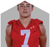 A young man wearing a white jersey with the number 10 on it. Description generated by AI