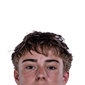 A young man wearing a white jersey with the number 10 on it. Description generated by AI