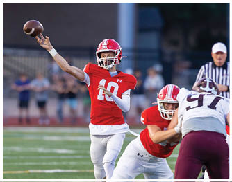 A football player running on the field. Description generated by AI