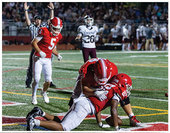 A football player running on the field. Description generated by AI