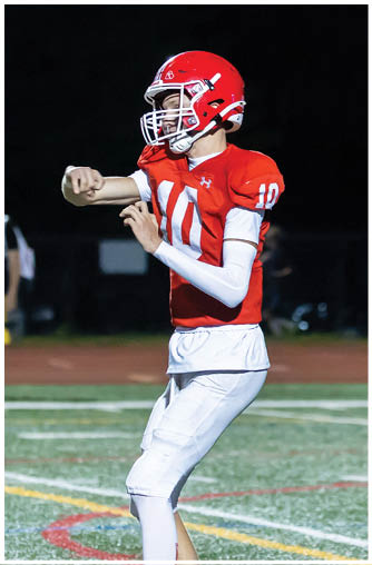 A football player running on the field. Description generated by AI