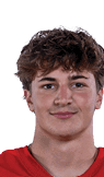 A young man wearing a white jersey with the number 10 on it. Description generated by AI
