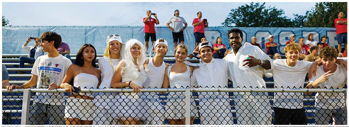 A group of football players on a field. Description generated by AI