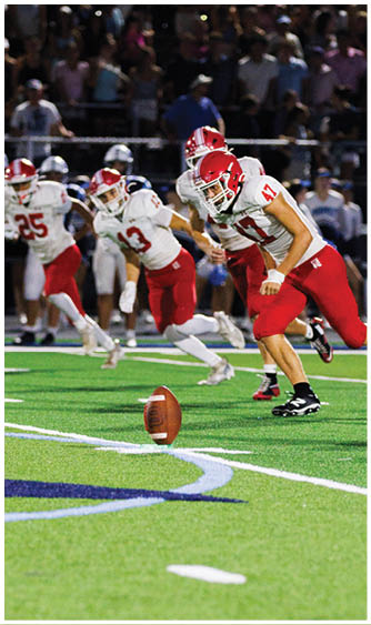 A football player running on the field. Description generated by AI