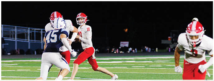 A football player is sliding on the ground. Description generated by AI