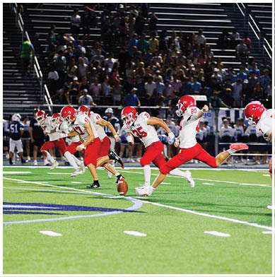 A football player running on the field. Description generated by AI