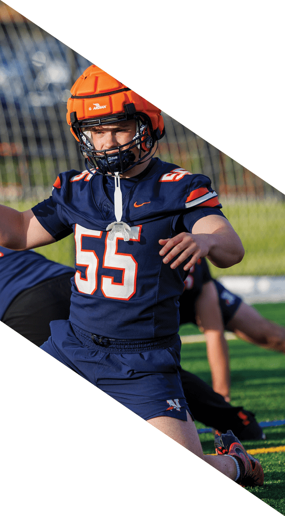 A football player wearing a black helmet and white jersey is holding a football in his hands. AI generated content