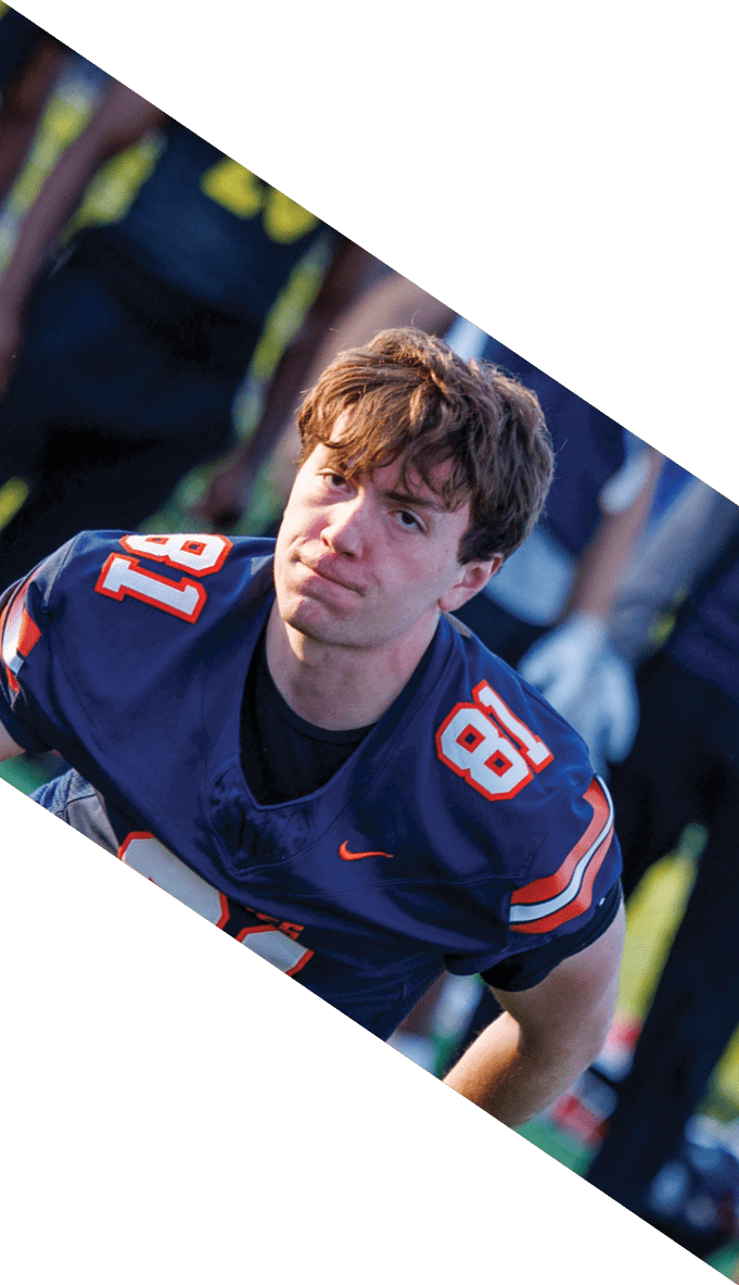 A football team is gathered around a coach, listening to his instructions. AI generated content