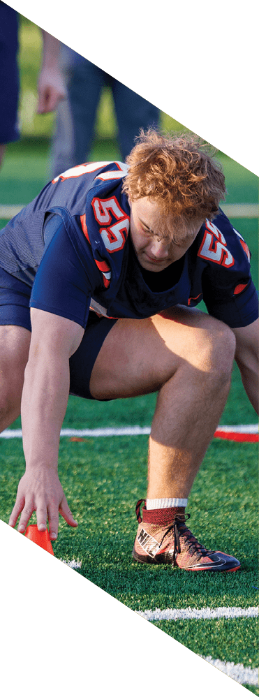 Two young men wearing football uniforms and making hand gestures. AI generated content