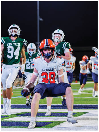 A football player wearing a blue jersey with the number 58 on it. Description generated by AI