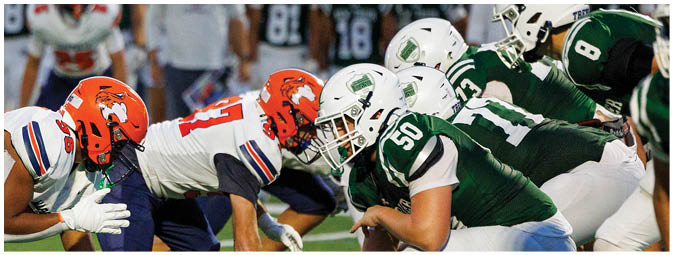 A football player is sliding on the ground. Description generated by AI