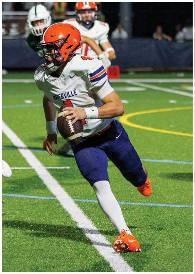 A football player wearing a blue jersey with the number 58 on it. Description generated by AI