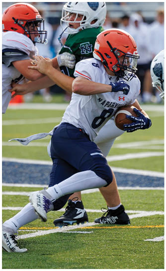 A football player catching a ball. Description generated by AI
