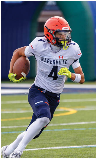 A football player catching a ball. Description generated by AI