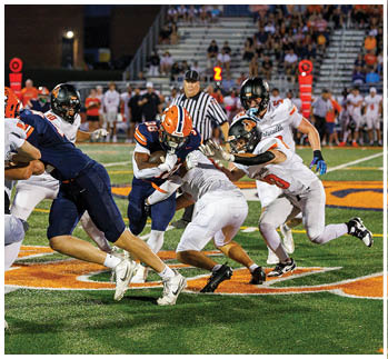 A football player running on the field. Description generated by AI
