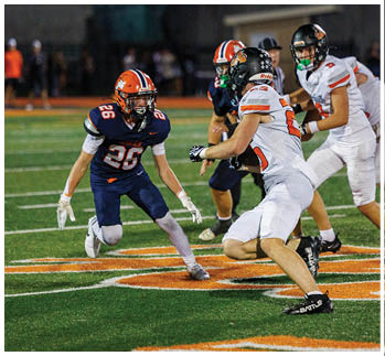 A football player running on the field. Description generated by AI