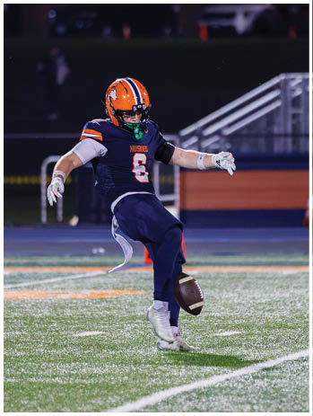 A football player wearing a blue jersey with the number 58 on it. Description generated by AI