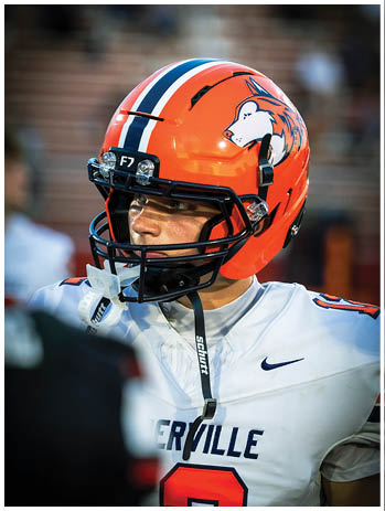 A football player wearing a blue jersey with the number 58 on it. Description generated by AI