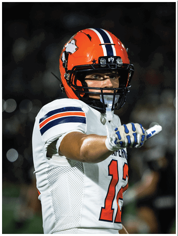A football player wearing a blue jersey with the number 58 on it. Description generated by AI