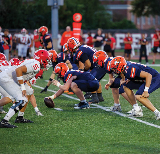 A group of football players celebrating a victory. AI generated content