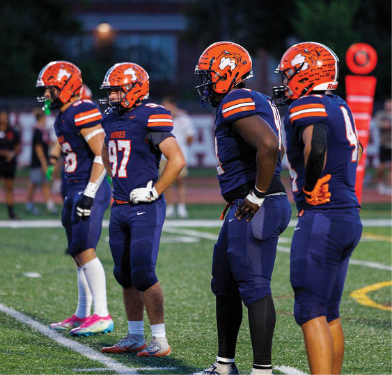 A group of football players celebrating a victory. AI generated content