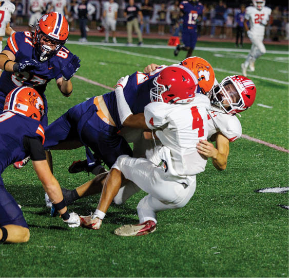 A group of football players celebrating a victory. AI generated content