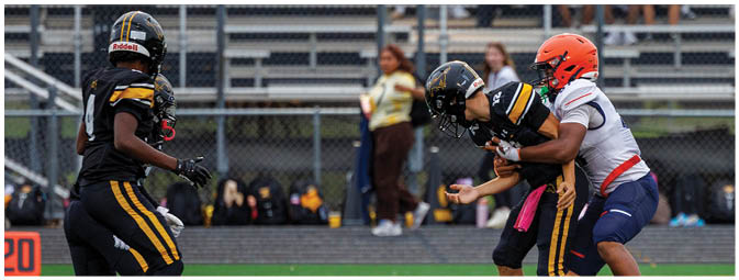 A football player is sliding on the ground. Description generated by AI