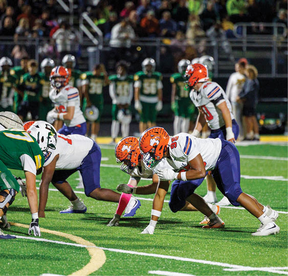 A group of football players celebrating a victory. AI generated content