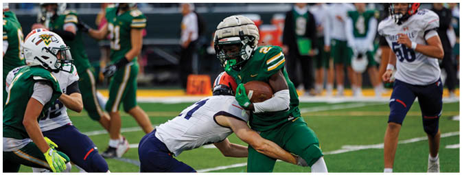 A football player is sliding on the ground. Description generated by AI