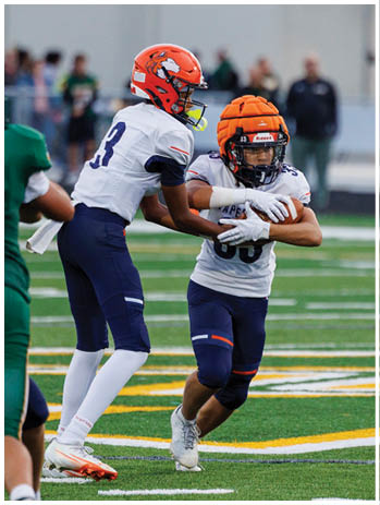 A football player wearing a blue jersey with the number 58 on it. Description generated by AI