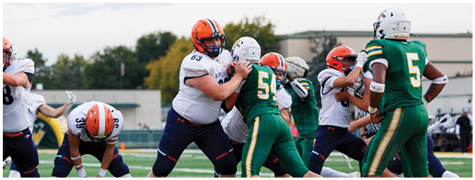 A football player is sliding on the ground. Description generated by AI