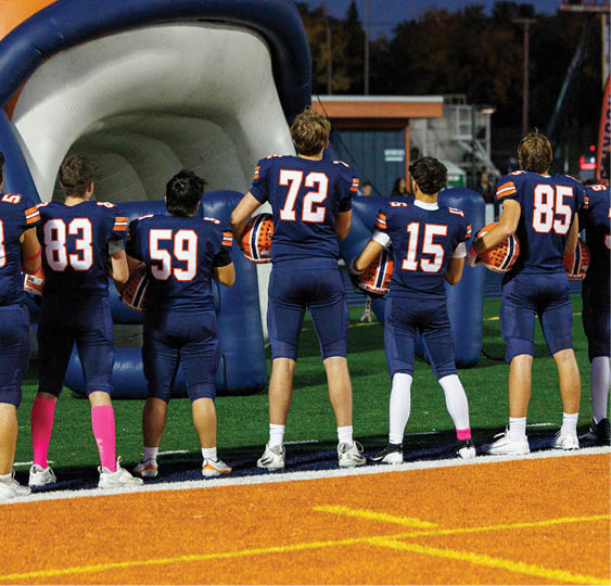 A group of football players celebrating a victory. AI generated content