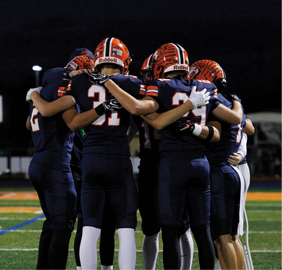 A group of football players celebrating a victory. AI generated content