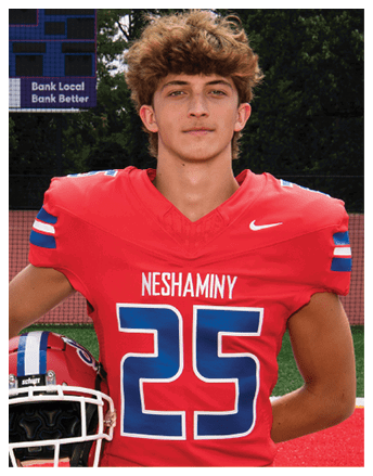 A red sports jersey with the name “NESHAMIN" and a large blue and white number partially visible. Description generated by AI