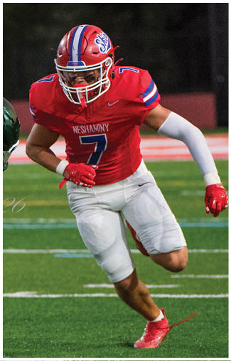 A football player running on the field. Description generated by AI