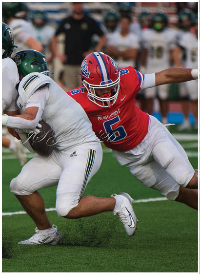 A football player wearing a blue jersey with the number 58 on it. Description generated by AI
